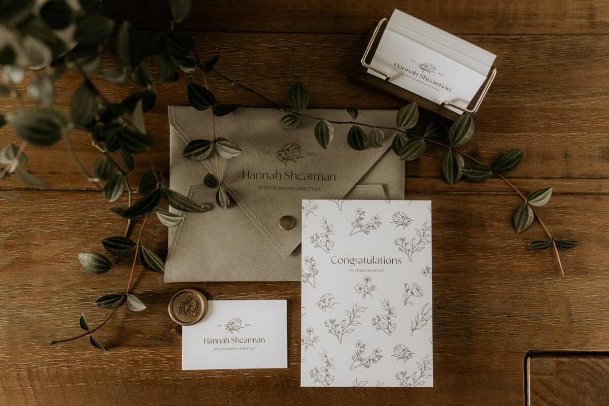 Marketing design items featuring Hannah’s bespoke brand pattern
