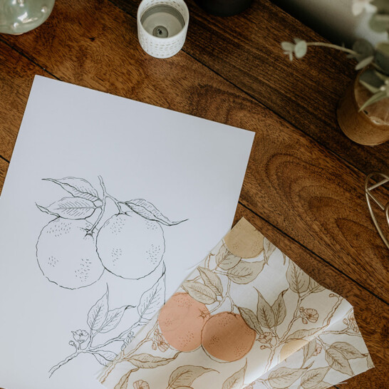 Orange blossom pattern printed on fabric for nature inspired products.